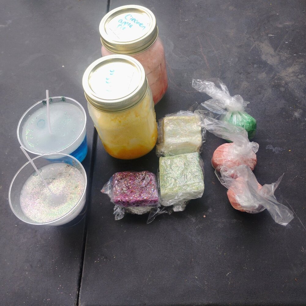 Homemade bath bombs, sugar scrubs, water candles, and bar soaps